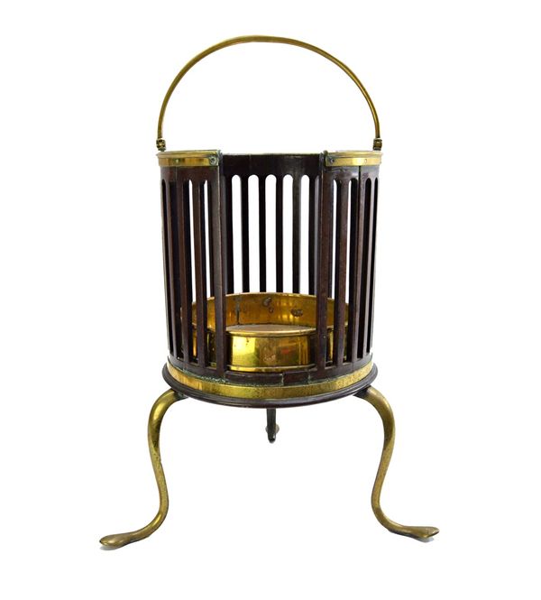 A late 18th/ early 19th century brass mounted mahogany plate bucket with slatted open body on three brass cabriole supports, 64cm high, handle up.   I