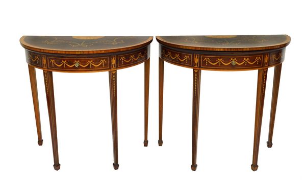 A pair of late 19th century marquetry inlaid satinwood banded mahogany semi-elliptic card tables on tapering square supports, each 81cm wide.  Illustr