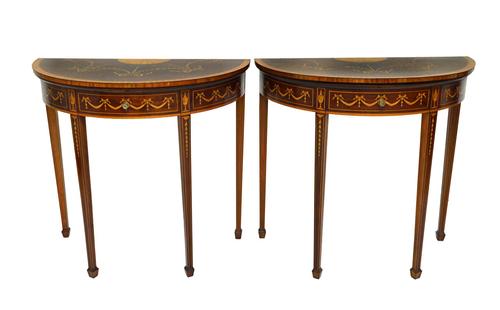A pair of late 19th century marquetry inlaid satinwood banded mahogany semi-elliptic card tables on tapering square supports, each 81cm wide.  Illustr