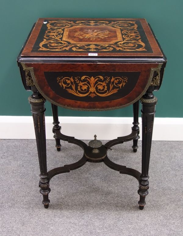 A 19th century marquetry inlaid gilt metal mounted amboyna and ebonised square drop flap table with four shaped leaves on tapering fluted supports, un