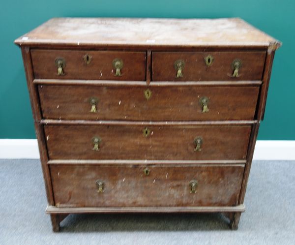 A 17th century oak two part chest of two short and three long graduated drawers, on block supports, 101cm wide.