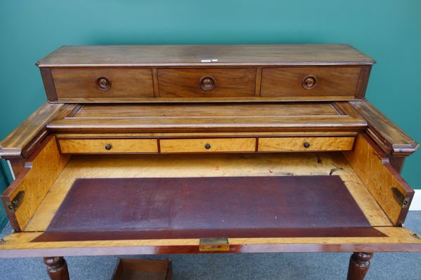 A 19th century mahogany secretaire, the three drawer super structure over pull-out fitted interior and three further frieze drawers, on turned support