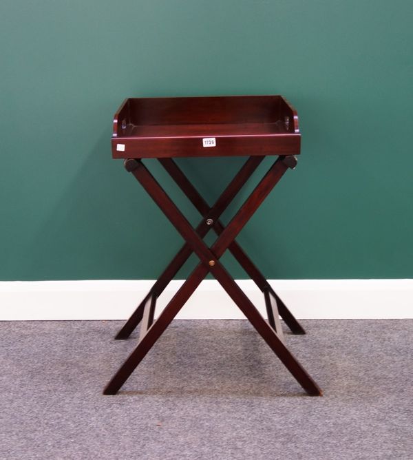 A small 19th century mahogany butler's tray on a folding stand, 50cm wide.