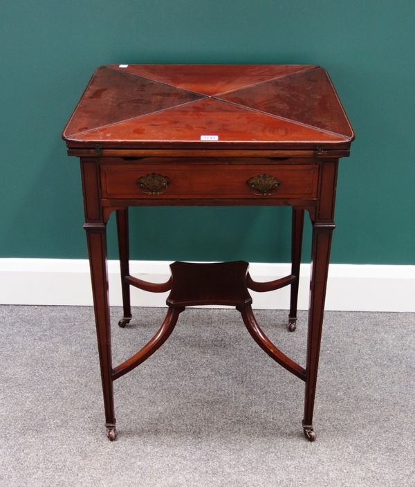 A late Victorian mahogany envelope card table, the single frieze drawer on tapering square supports, with 'X' frame stretcher, 56cm wide.