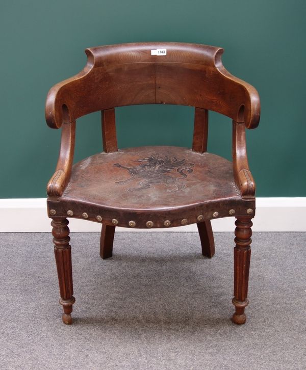 A 19th century French oak tub back chair, with studded leather seat on turned supports.