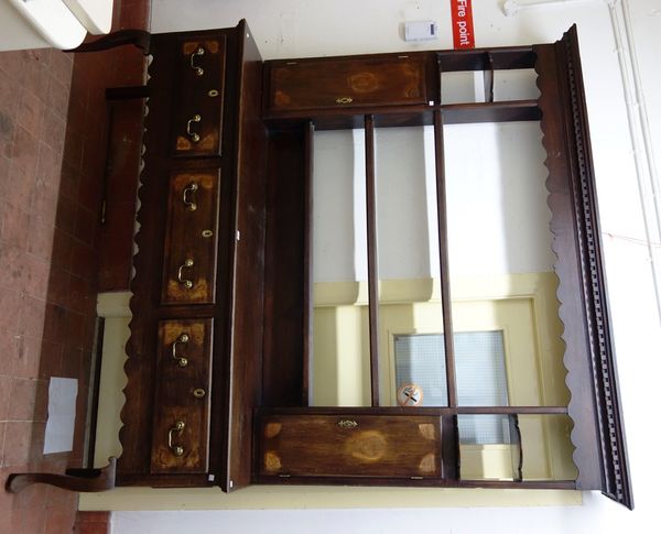 An 18th century oak dresser, the three tier open plate rack with pair of spice cupboards, the base with three drawers over wavy frieze on cabriole sup