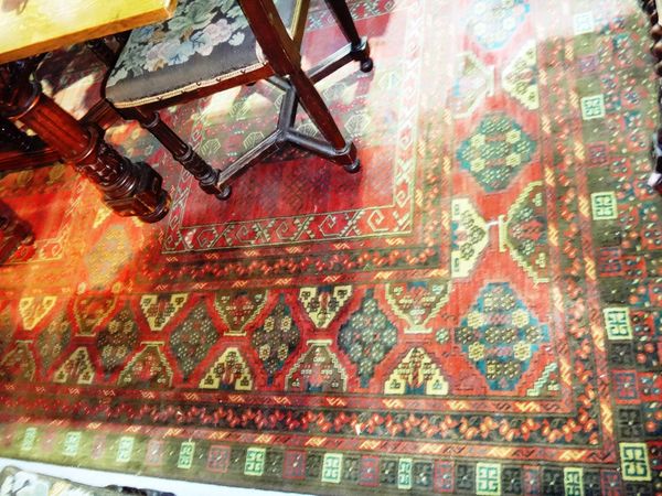 A machine made carpet of Afghan design, 302cm x 201cm.
