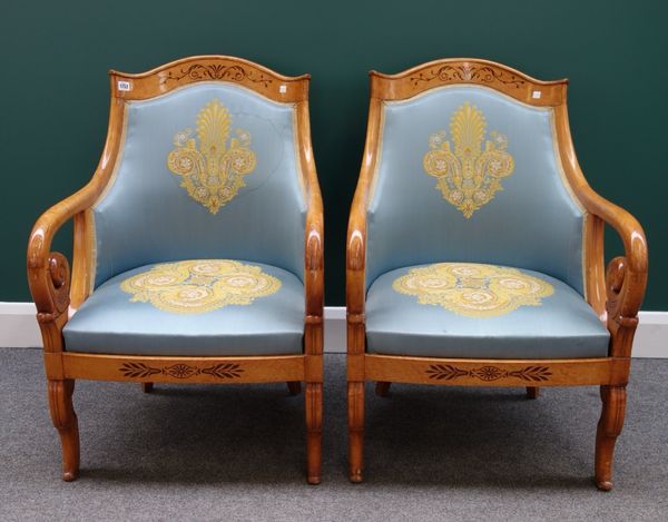 A set of four Biedermeier design inlaid maple tub back armchairs with shepherd's scroll arms, bow seat and sabre supports.