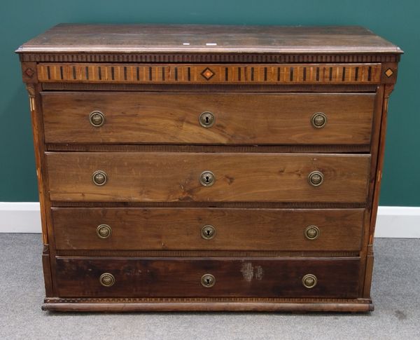 A late 18th/early 19th century German oak inlaid commode, with five long graduated drawers, flanked by split turned columns, 123cm wide.