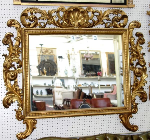 A 19th century Italian gilt framed rectangular wall mirror, with shell and pierced acanthus scroll mounted frame, the lower frieze with pair of sabre