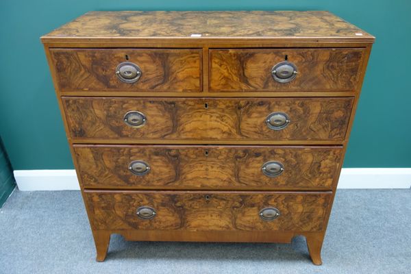 A George III walnut chest, with two short and three long graduated drawers, on splayed bracket feet, 107cm wide.