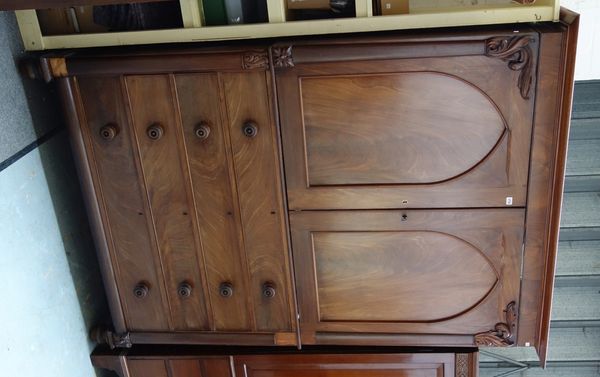 A William IV mahogany linen press, with pair of Gothic arch panel doors over four long graduated drawers, on turned feet, 154cm wide x 217cm high.