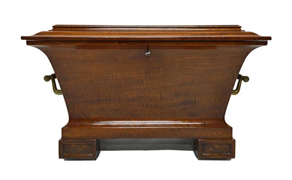 A Regency mahogany sarcophagus shaped wine cooler on block supports, 83cm wide.  Illustrated