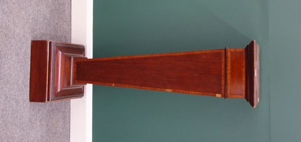 An Edwardian satinwood banded mahogany pedestal, with tapering column and flared base, 119cm high.