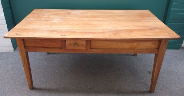 A 19th century French cherry wood kitchen table, the frieze with pair of sliding baguette drawers and one other short drawer, on tapering square suppo