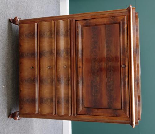 A 19th century North European mahogany secretaire a abattant, the fall revealing a fitted interior over three shaped long drawers, on squat cabriole s