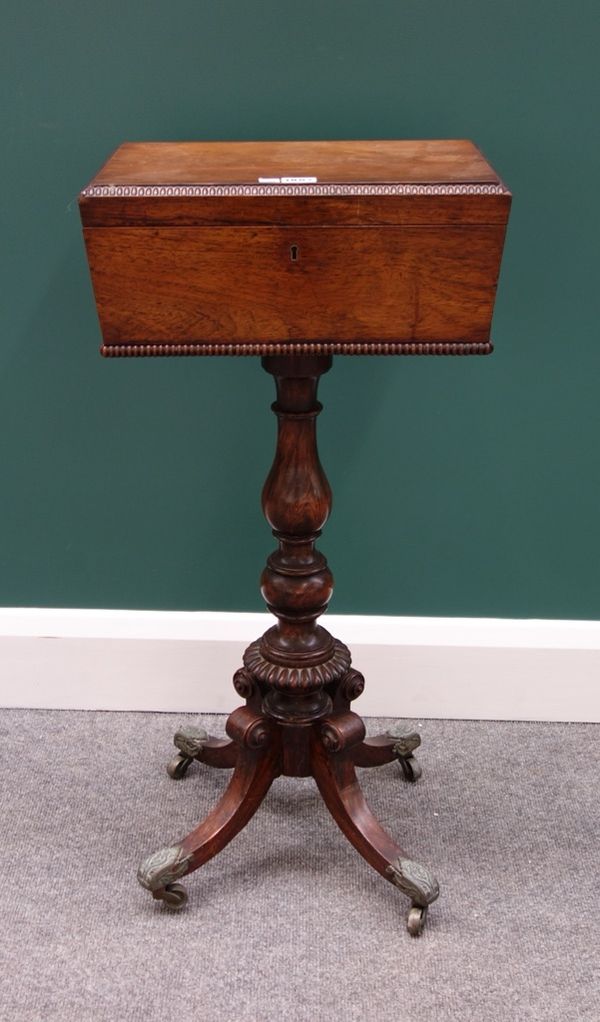 A Regency rosewood teapoy, with later fitted interior, on a faux rosewood column and four downswept supports, 38cm wide.