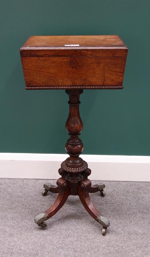 A Regency rosewood teapoy, with later fitted interior, on a faux rosewood column and four downswept supports, 38cm wide.