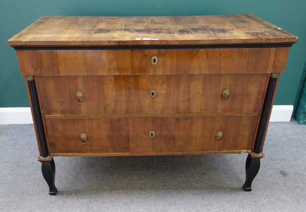 A 19th century French walnut and ebonised three drawer commode, flanked by gilt metal mounted split turned columns, on square baluster supports, 125cm