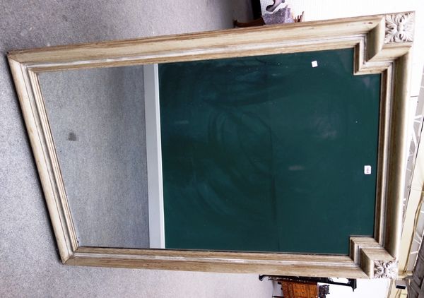 A cream painted rectangular wall mirror, the crest rail with inset corners mounted with acanthus busts, 112cm wide x 166cm high.