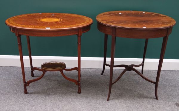 An Edwardian inlaid oval mahogany occasional table on four turned supports united by shaped 'X' frame undertier, 80cm wide, together with another simi