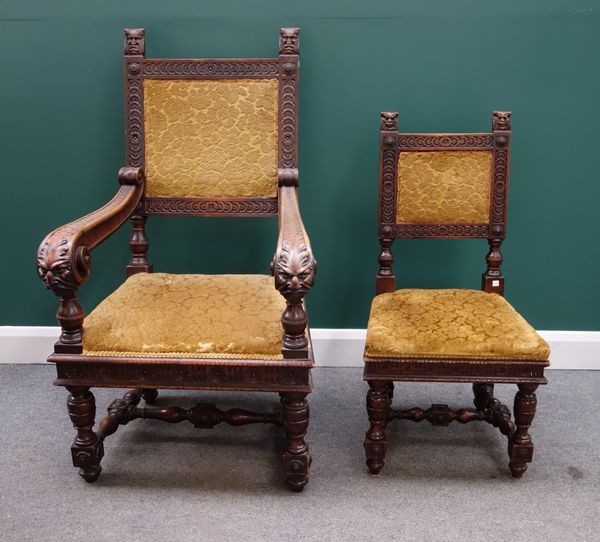 A set of six 19th century Gothic Revival oak framed dining chairs with grotesque mask finials on block and turned supports, to include a pair of carve