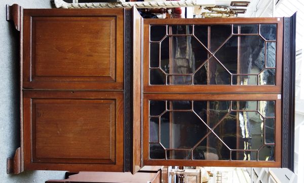 A George III mahogany bookcase cupboard, with pair of astragal glazed doors over pair of panel cupboards, on ogee bracket feet, 122cm wide x 213cm hig