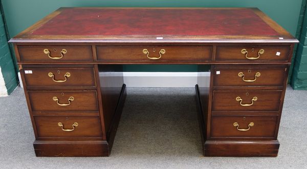 An 18th century style mahogany pedestal desk with nine drawers about the knee, 153cm wide.