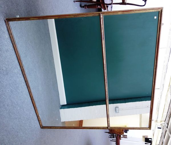 A large gilt framed rectangular two part wall mirror, with floral decorated frame, 177cm wide x 176cm high.