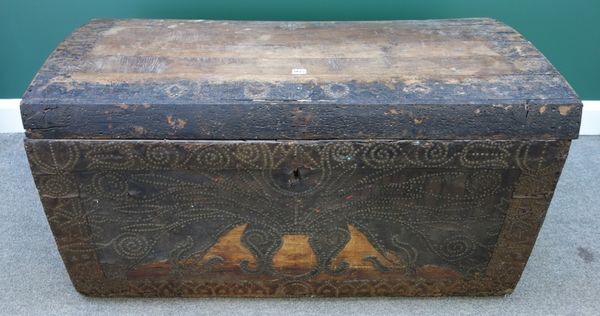 A brass studded leather veneered oak framed dome top trunk, with wrought iron carry handles, probably 16th century, 120cm wide (a.f).