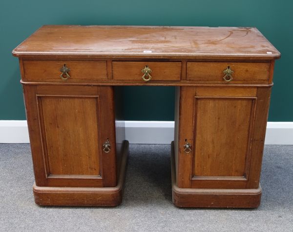 A 19th century mahogany pedestal desk, with three frieze drawers over pair of cupboards, the drawer stamped 'Heal & Son, London', 108cm wide (reduced)