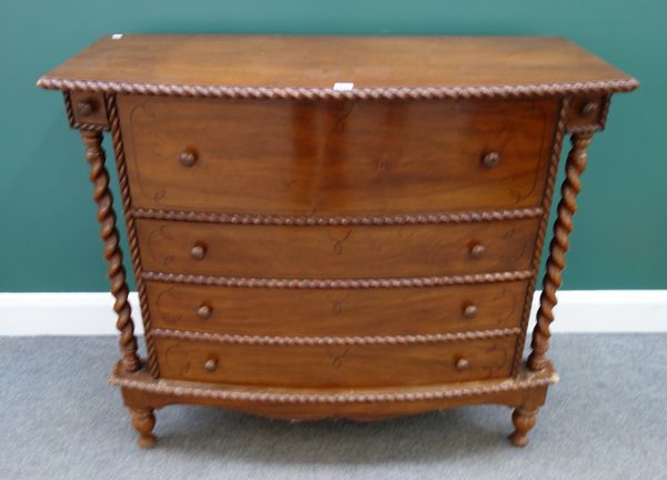 A Colonial hardwood bowfront secretaire chest, the fitted  drawer over three further long drawers flanked by free standing barleytwist supports, 110cm