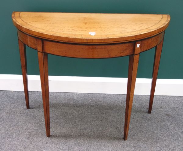 A George III inlaid satinwood demi-lune card table on tapering square supports, 99cm wide.