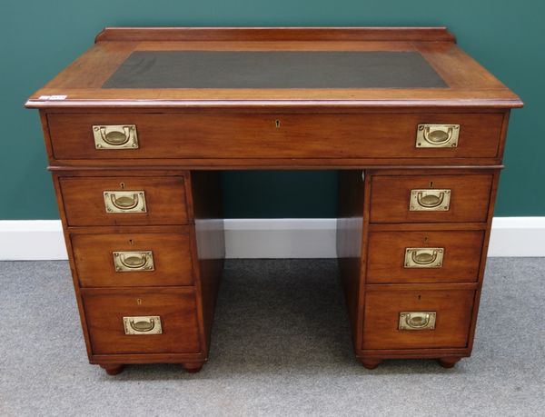 A 19th century mahogany campaign/naval style pedestal desk, with seven drawers about the knee, each fitted with friction roller shutters (to prevent u