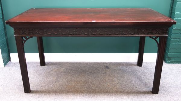 An 18th century style rectangular mahogany serving table, with blind fret frieze on chanelled canted square supports, 167cm wide.