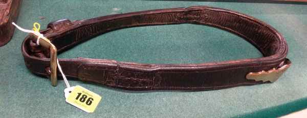 A late 19th century leather and brass mounted donkey collar or harness, of typical form with makers plaque inscribed “J Lee Maker Kingston”, 36cms hig