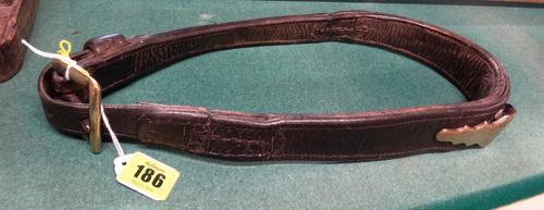 A late 19th century leather and brass mounted donkey collar or harness, of typical form with makers plaque inscribed “J Lee Maker Kingston”, 36cms hig