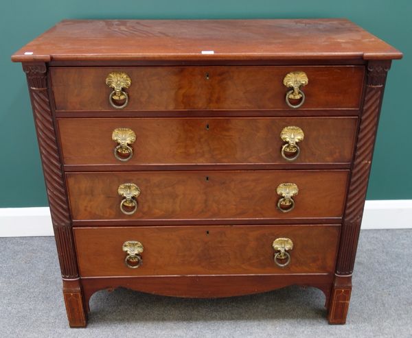 A Regency mahogany Channel Islands chest with four long graduated drawers flanked by split spiral and fluted columns on block feet, 104cm wide.