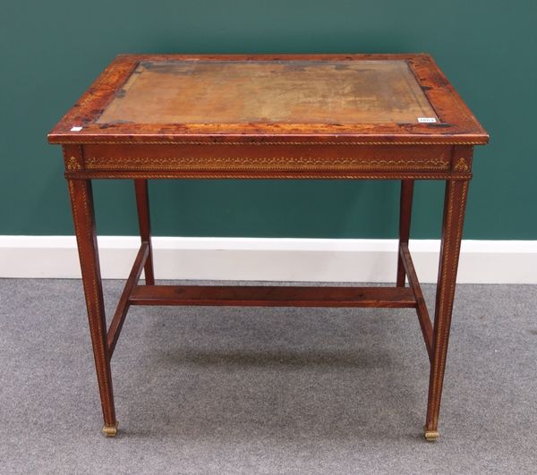 An early 20th century gilt tooled rectangular leather veneered centre table on tapering square supports and gilt bronze feet, 80cm wide.