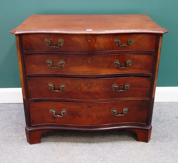 A mid 18th century mahogany serpentine chest of four long graduated drawers, with inlaid canted corners, on bracket feet, 93cm wide.