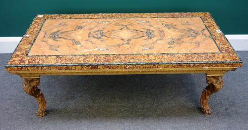 A 20th century Italian coffee table, the rectangular Verde Antico, Siena and Brocatelle marble top on a giltwood base of four scroll supports, 121cm x