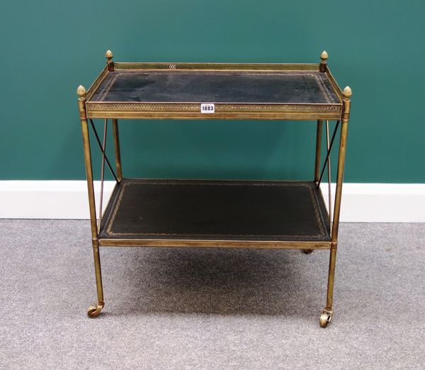 An early 20th century French rectangular gilt metal two tier etagere, with tooled leather decoration and turned supports, 64cm wide.