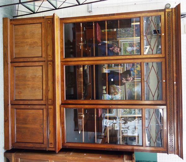 A Victorian rosewood bookcase/cupboard with three glazed doors over three drawers and cupboards on plinth base 220cm wide x 273cm high.