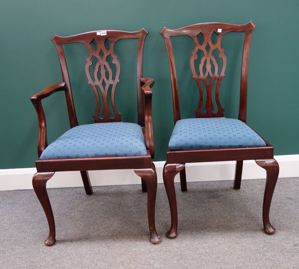 A set of six 18th century style mahogany framed dining chairs with pierced splat and cabriole supports to include a pair of carvers.