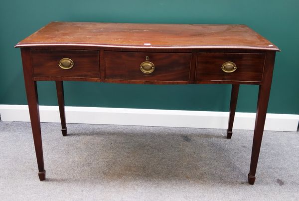 A George III mahogany serving table, the serpentine top over three frieze drawers, on tapering square supports, 133cm wide.
