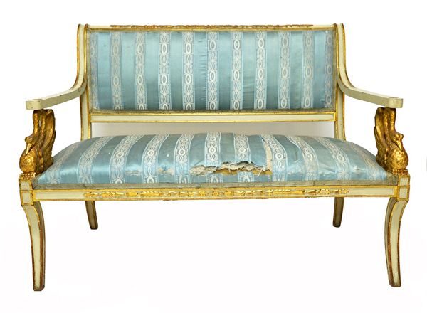 A 19th century Italian white painted parcel gilt salon suite, to comprise; a sofa, 131cm wide, a pair of open armchairs, and four single chairs, all w
