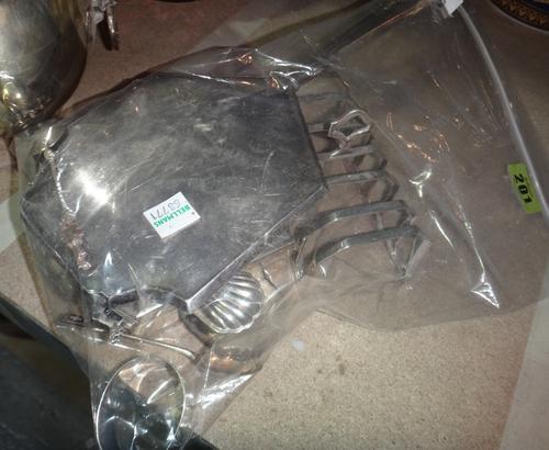 A silver cigarette case, a toast rack, a hand mirror, a brush back, a napkin ring and eight mostly silver and enamel spoons.