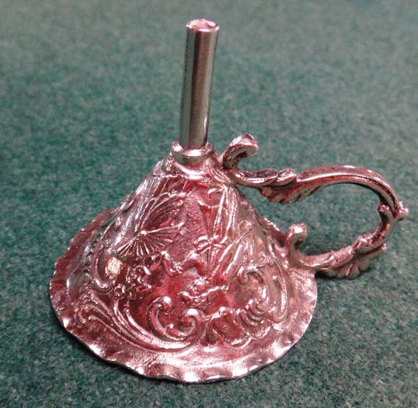 A silver perfume bottle funnel, hallmarked .925 maker's mark RML, scrolling handle above conical body with relief decoration of courtly figures, 4cms
