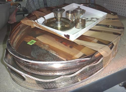 A quantity of silver plated items including a candlestick, a napkin ring, a mustard pot, two oval gallery trays and sundry.