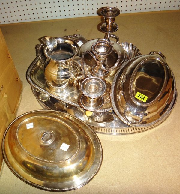 A group of silver plated wares, comprising; an oval gallery tray, a rectangular tray with gadroon border, a pair of butter shells, an oval lidded entr
